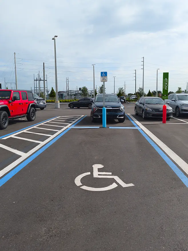 Florida accessible parking bay and access aisle Accessible parking bay with marked access aisle in a Florida car park